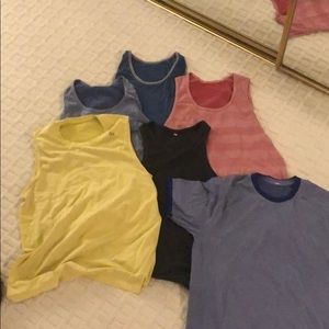 SOLD Men’s tank tops (6) and tee shirt (1). SOLD